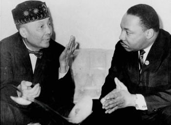 Dr. Martin Luther King, Jr., right, pictured in his first meeting with the Honorable Elijah Muhammad, left, head of the Black Muslims, said February 24, 1966, in Chicago, IL